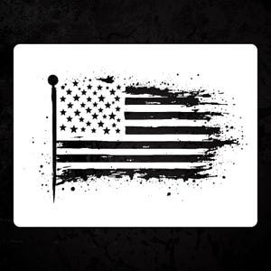 May include: Black and white distressed American flag design. The flag features stars and stripes with a grunge effect, and a flagpole on the left side. The design is on a white background with a black textured border.
