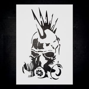 a black and white drawing of a gas mask
