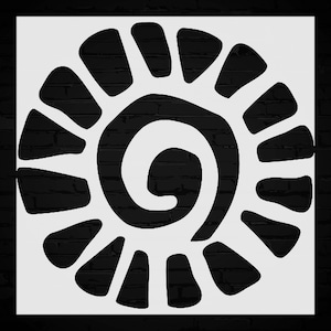 May include: A white stencil featuring a stylized spiral sun design with radiating shapes. The design is set against a black brick background, creating a high-contrast, graphic image. The spiral is a central element.