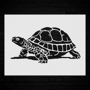 May include: A black and white illustration of a turtle. The turtle is depicted in a side profile, showcasing its shell, head, and legs. The artwork is a silhouette style, with the turtle against a white background.