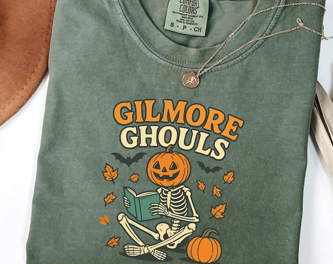 Gilmore Ghouls Halloween Shirt: Pumpkin Skeleton Reading Cotton Tee