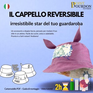 May include: A reversible purple hat with ear-like protrusions and a floral patch. The hat is part of a pattern, with text in Italian. The image also includes diagrams of hat styles and the text "2h".