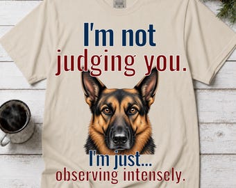 T-shirt humoristique pour les propriétaires de chiens, représentant un berger allemand observant avec attention.