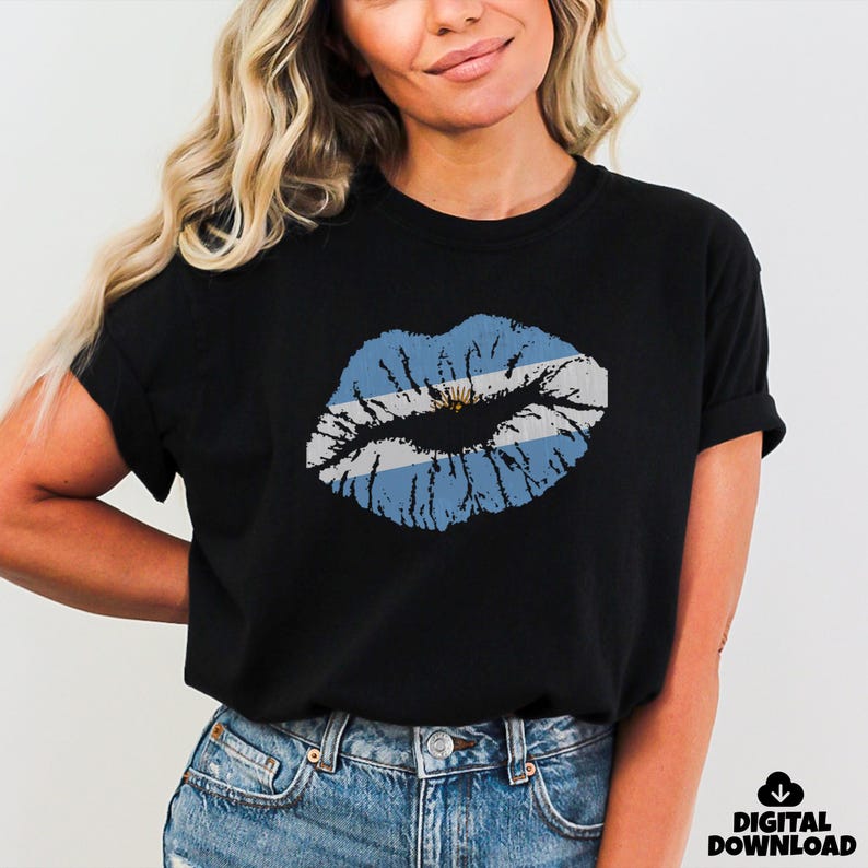 May include: Black t-shirt featuring a distressed design of lips in the colors of the Argentinian flag: light blue, white, and gold. The shirt has short sleeves and a crew neck. The words "DIGITAL DOWNLOAD" are in the lower right corner.
