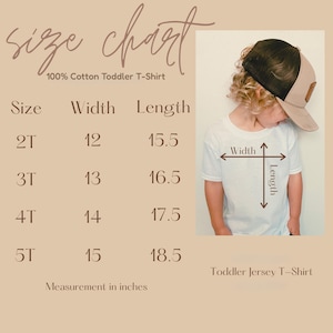 May include: A size chart for a toddler t-shirt, with measurements in inches. The chart includes sizes 2T, 3T, 4T, and 5T, with corresponding width and length measurements. A child wearing a white t-shirt is also shown.