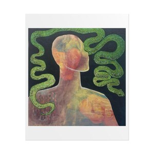 May include: A square art print featuring a translucent human silhouette in shades of orange, yellow, and brown against a black background. A long, textured green snake curves around the head and shoulders of the figure.