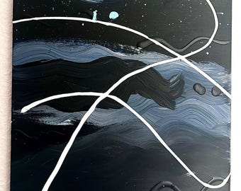 May include: Abstract painting on a black canvas with white and blue brushstrokes. The painting features a white line that curves and loops across the canvas.