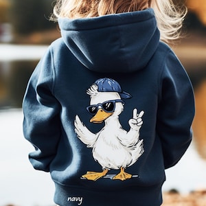 May include: Navy blue hooded sweatshirt featuring a cartoon duck wearing sunglasses and a baseball cap, giving a peace sign. The word "navy" is printed at the bottom. The sweatshirt is shown from the back.