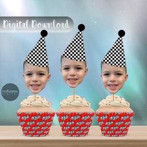 May include: Three cupcake toppers featuring a black and white checkered party hat with a child's face peeking out from the bottom. The cupcakes are decorated with red and white frosting and a red and white checkered pattern.