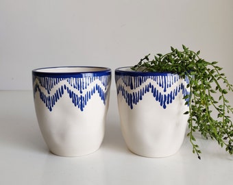 Pair of navy blue and off white ceramic planters