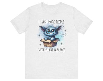 T-Shirt, Adorable Wide-Eyed Creature, "Fluent in Silence" Quote, Whimsical Introvert Tee