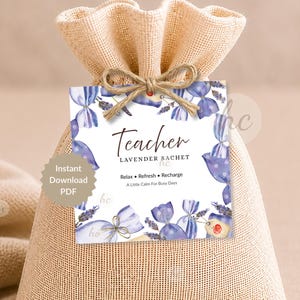 May include: A beige burlap bag tied with twine, holding a tag that reads "Teacher Lavender Sachet." The tag features watercolor illustrations of lavender sachets in shades of purple and blue. The text on the tag also says "Relax, Refresh, Recharge, A Little Calm For Busy Days."
