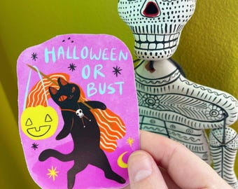 May include: A pink sticker with a black cat carrying a jack-o-lantern. The cat is wearing a skull necklace and has orange stripes on its back. The sticker says "Halloween or Bust" in white text.