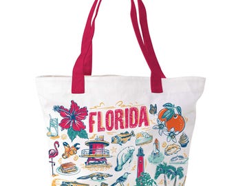 May include: White tote bag with red handles featuring a colorful illustration of Florida landmarks and the word "FLORIDA". The design includes a hibiscus flower, orange, flamingo, and a lighthouse.