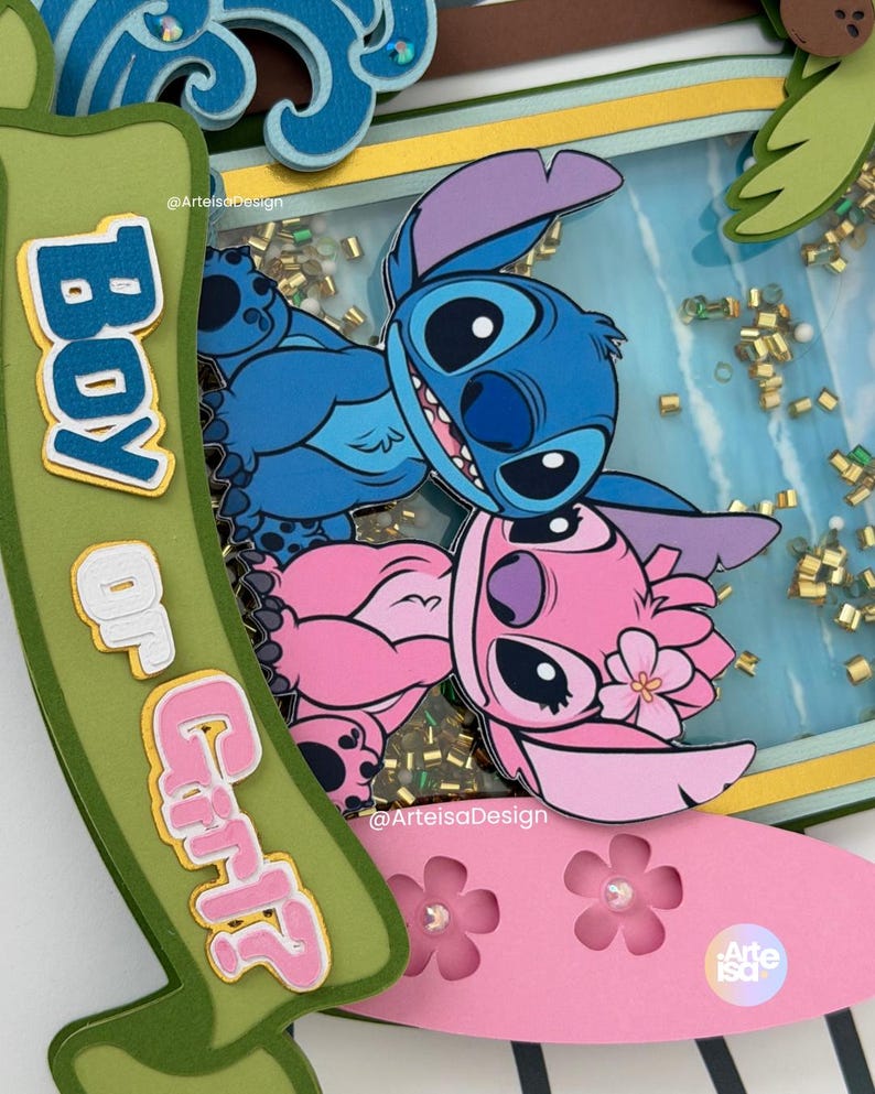 May include: A layered paper craft featuring the characters Stitch and Angel from Lilo & Stitch. The design includes a blue and pink color scheme, with the words "Boy or Girl" on a green banner. The background has gold confetti.