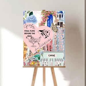 May include: A decorative sign on a wooden easel with a collage design. The sign features a pink heart with text that reads "Final Fling Before The Ring" and "Anna's Bachelorette Weekend." The collage includes floral and architectural elements.