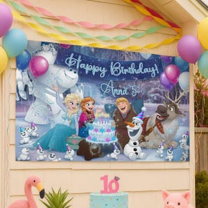 May include: A rectangular birthday banner featuring Frozen characters including Elsa, Anna, Kristoff, Sven, and Olaf. The banner displays the text Happy Birthday and Anna 5 in a blue script font. The scene includes a birthday cake and snowmen.