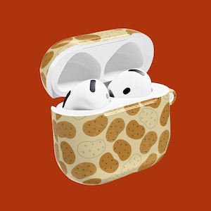 May include: White wireless earbuds in an open case with a potato pattern, set against an orange-red backdrop. The case features a beige background with brown potato illustrations. The earbuds are visible inside.