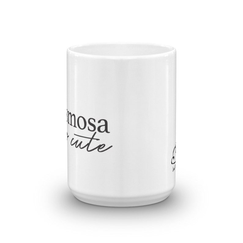 May include: White ceramic mug with black text that reads "Mimosa cute".