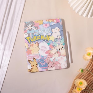 May include: A rectangular notebook featuring a colorful collage of various cartoon characters and the word Pokémon in yellow text. A central white oval contains the text Thank you for falling in love with me, and a small label says you're cute.