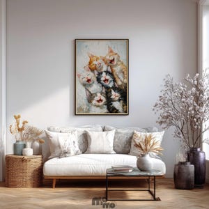 May include: A framed painting depicts a group of laughing cats with open mouths and various fur colors, including orange, black, and white. The artwork is displayed above a white sofa with decorative pillows, enhancing the room's decor.