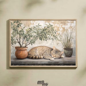 May include: Framed artwork featuring a sleeping tabby cat on a ledge, flanked by potted plants. The cat is curled up, eyes closed, with a light brown and gray striped coat. The background has a neutral color palette with a textured effect.