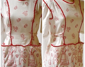 Vintage 1960s Red and White Cotton Kitchen Smock Apron Pinnie with Scandinavian Swedish Hearts Flowers Dancing People Print