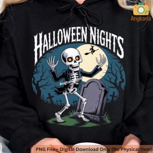 May include: Black hoodie featuring a Halloween-themed graphic. The design includes a skeleton in a suit, a tombstone, a witch on a broom, and the words "HALLOWEEN NIGHTS". The background has a full moon and a spooky forest.