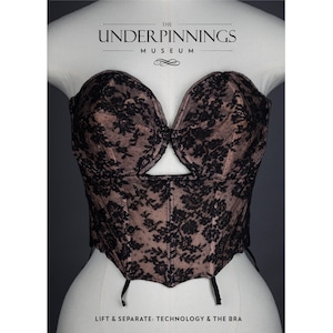 May include: A black and brown lace corset with a cutout in the front. The corset is on a white mannequin. The text "THE UNDERPINNINGS MUSEUM" is at the top of the image. The text "LIFT & SEPARATE: TECHNOLOGY & THE BRA" is at the bottom of the image.