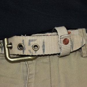 Belt: constructed from Reclaimed fire hose Featuring copper and antique brass 34&quot;