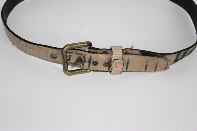 Belt 32 constructed from Reclaimed fire hose Featuring copper and antique brass