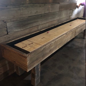 The Kerf shuffle board table with solid maple playing surface