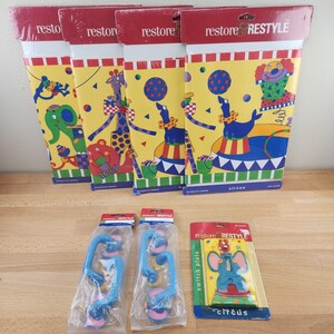 May include: A collection of circus-themed decorative borders and switch plates. The borders feature colorful illustrations of circus animals like elephants, giraffes, and seals. The switch plates have an elephant design. The text "restore & RESTYLE" is visible.