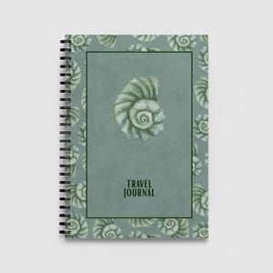 May include: A spiral-bound travel journal with a teal cover featuring a large seashell illustration and smaller seashell patterns. The words "TRAVEL JOURNAL" are printed in a dark green font.