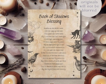 May include: A rectangular parchment-style paper featuring the text Book of Shadows Blessing at the top. The paper includes black ink illustrations of a cauldron, a crow, a cat, a figure, and a bottle, surrounded by stars and moon symbols.