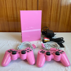 Pacchetto console Sony PlayStation 2 Pink Limited Edition SCPH-77004 - Testato, funzionante, include controller, scheda di memoria e gioco