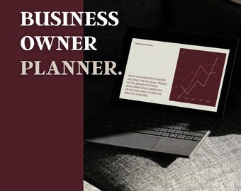 Op de afbeelding: Een laptop met een grafiek voor bedrijfsanalyse, rustend op een grijze, gestoffeerde ondergrond. Het scherm toont een grafiek met een rode lijn. De tekst "BUSINESS OWNER PLANNER" staat in grote witte letters. De laptop is open.