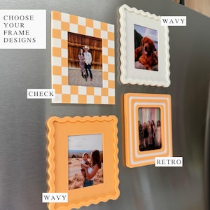 May include: Four photo frames in different designs and colours are displayed on a metallic surface. The frames include a checkered orange and white frame, a white wavy frame, and two orange wavy and retro frames. The text "CHOOSE YOUR FRAME DESIGNS", "CHECK", "WAVY", and "RETRO" are also visible.