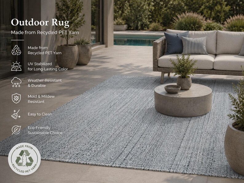 May include: A light blue outdoor rug made from recycled PET yarn. The rug is weather-resistant, mold and mildew resistant, and easy to clean. The rug is UV stabilized for long-lasting color. The rug is shown with outdoor furniture.