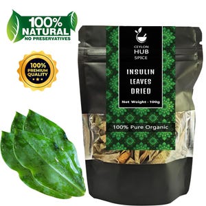 Puede incluir: Una bolsa negra de hojas de insulina secas de Ceylon Hub Spice, peso neto 100g. El empaque incluye texto que dice "100% Natural" y "100% Calidad Premium". Tres hojas verdes en primer plano.