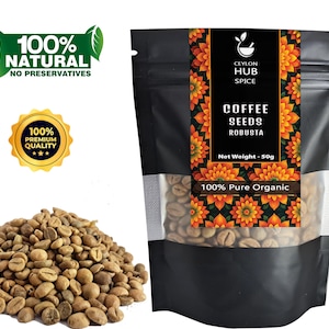 May include: A black bag of Ceylon Hub Spice Robusta coffee seeds with a clear window, beside a pile of raw coffee beans. The bag has text that reads "COFFEE SEEDS ROBUSTA" and "100% Pure Organic". There are also labels that say "100% NATURAL NO PRESERVATIVES" and "100% PREMIUM QUALITY". The net weight is 50g.
