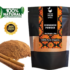 May include: A bag of Ceylon Hub Spice cinnamon powder with a pile of cinnamon powder and cinnamon sticks. The bag has text that reads "Cinnamon Powder", "100% Pure Organic", and "Net Weight - 50g". There are also two green leaf logos and a gold seal.