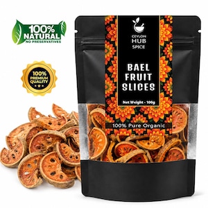 May include: A black stand-up pouch containing dried bael fruit slices, labelled Ceylon Hub Spice, 100g net weight, and 100% pure organic. The packaging features a floral pattern and a clear window showing the orange, circular, textured fruit slices.