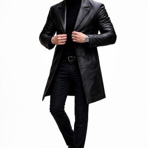 May include: A black leather trench coat with a classic lapel collar. The coat is worn over a black turtleneck and black pants. A silver watch is visible on the wrist. The outfit is completed with black leather boots.