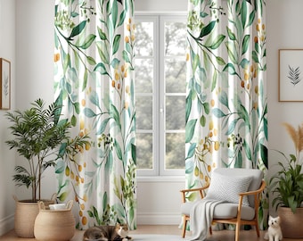 May include: White curtains with a watercolor botanical design featuring green leaves and yellow berries. The curtains hang from a dark metal rod, framing a window with a view of trees. A cat rests on a white rug in front of the window.