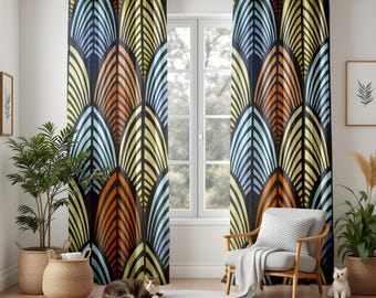 May include: A pair of patterned curtains with a repeating design of stylized leaves in shades of orange, yellow, blue, and black. The curtains hang in front of a window, with a chair and plants in the room. The curtains are made of a thick, opaque fabric.