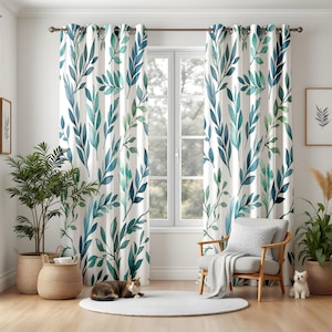 May include: White curtains with a watercolour leaf pattern in shades of blue and green hang in front of a window. The curtains are paired with a wooden chair, a white rug, and potted plants. A cat and a small dog are in the room.