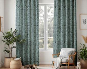May include: Two teal-colored curtain panels with a black floral pattern hang on a rod above a window. The curtains are the focal point of a room with a chair, plants, and a cat. The curtains have metal grommets for hanging.