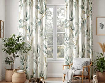 May include: A pair of off-white curtains with a repeating pattern of green and gold leaves. The curtains hang from a dark metal rod in front of a window. The room also features a chair, plants, and a cat.