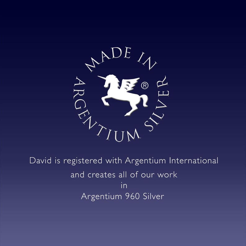May include: A white logo with a unicorn and the text "MADE IN ARGENTIUM SILVER" in a circle. The text "David is registered with Argentium International and creates all of our work in Argentium 960 Silver" is below the logo.